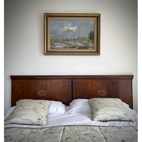 3125 - A mahogany and inlaid double bed head, probably French circa 1900, with oval basket of flower panel,... 