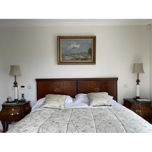 3125 - A mahogany and inlaid double bed head, probably French circa 1900, with oval basket of flower panel,... 