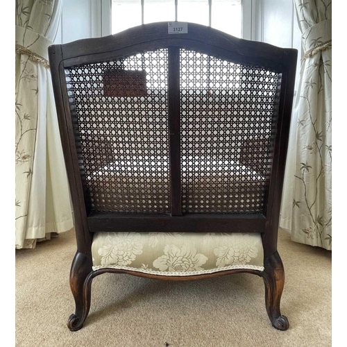 3127 - A French stained beech Bergere chair, with cane back and arms, upholstered seat on carved cabriole l... 