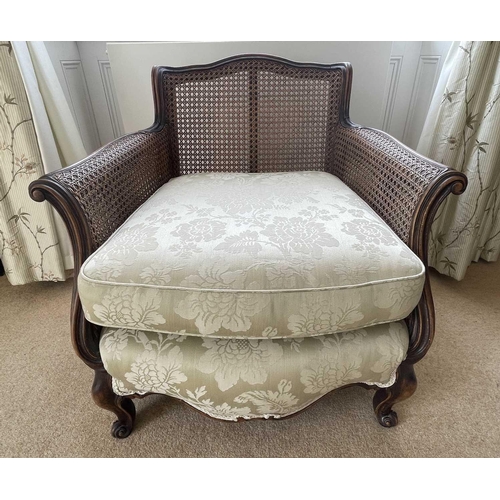 3127 - A French stained beech Bergere chair, with cane back and arms, upholstered seat on carved cabriole l... 