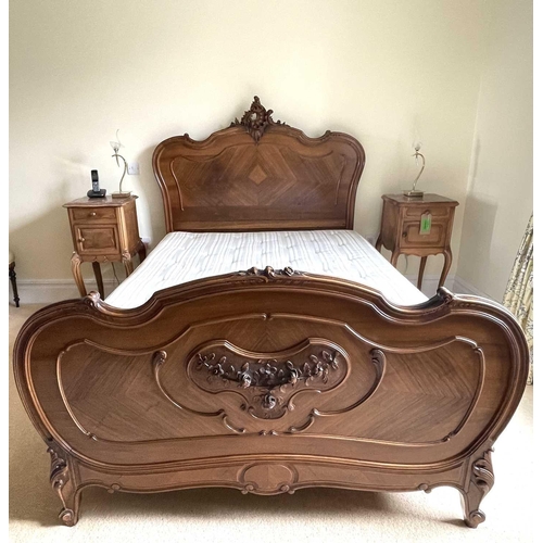 3131 - A French walnut bed, late 19th century, the foot and head with carved decoration, complete with side... 