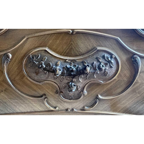 3131 - A French walnut bed, late 19th century, the foot and head with carved decoration, complete with side... 