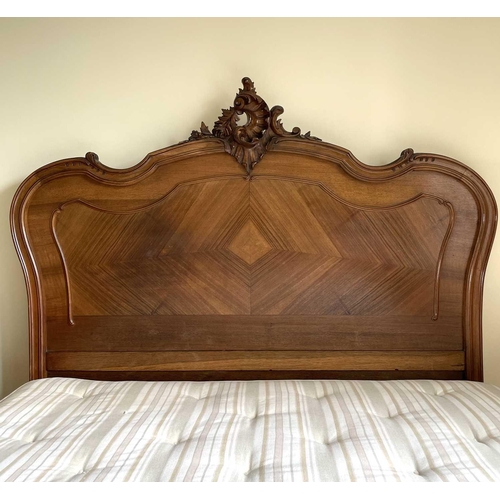 3131 - A French walnut bed, late 19th century, the foot and head with carved decoration, complete with side... 