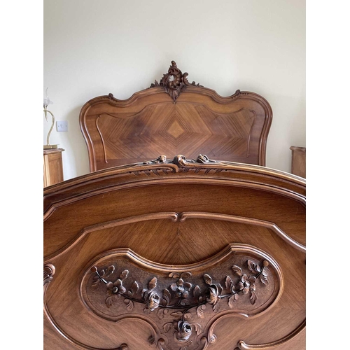 3131 - A French walnut bed, late 19th century, the foot and head with carved decoration, complete with side... 