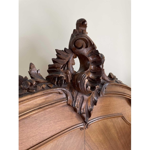 3131 - A French walnut bed, late 19th century, the foot and head with carved decoration, complete with side... 