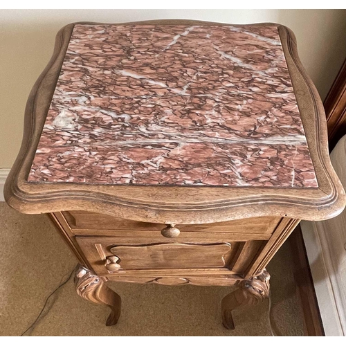 3133 - A French walnut bedside cupboard, late 19th century, with inset marble top above a drawer and cupboa... 