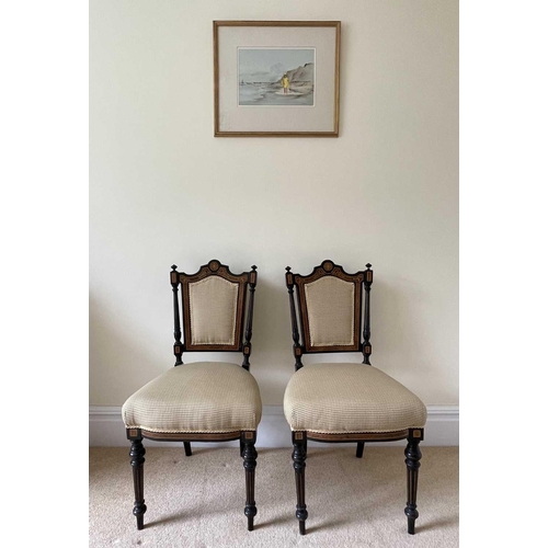 3137 - A pair of Victorian aesthetic movement ebonised and burr walnut side chairs, with padded backs and s... 