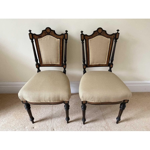 3137 - A pair of Victorian aesthetic movement ebonised and burr walnut side chairs, with padded backs and s... 