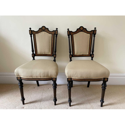 3137 - A pair of Victorian aesthetic movement ebonised and burr walnut side chairs, with padded backs and s... 