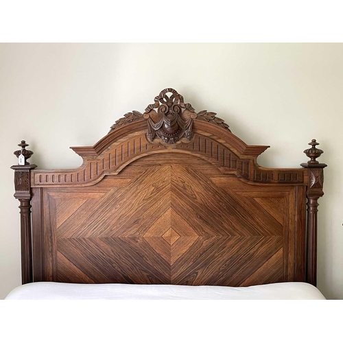 3138 - A 19th century French rosewood bed, the quarter veneered head and footboard with carved and turned d... 