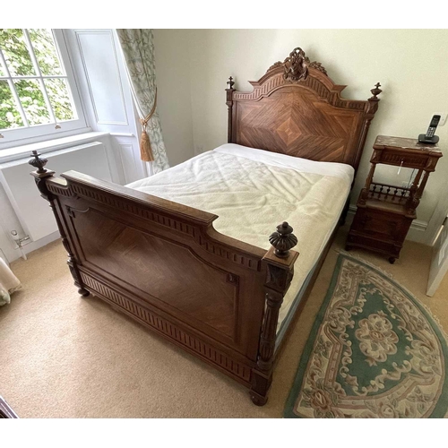 3138 - A 19th century French rosewood bed, the quarter veneered head and footboard with carved and turned d... 