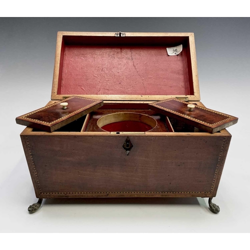 314 - A George III mahogany, inlaid and chequer strung tea caddy, with fitted interior and brass lion mask... 