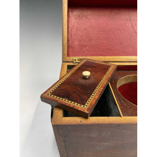 314 - A George III mahogany, inlaid and chequer strung tea caddy, with fitted interior and brass lion mask... 