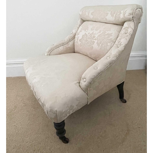 3142 - A late Victorian ebonised nursing chair, upholstered in Sanderson fabric, raised on turned front leg... 