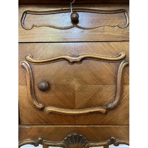 3146 - A French walnut bedside cupboard, late 19th century, with marble top above a door and a drawer on ca... 