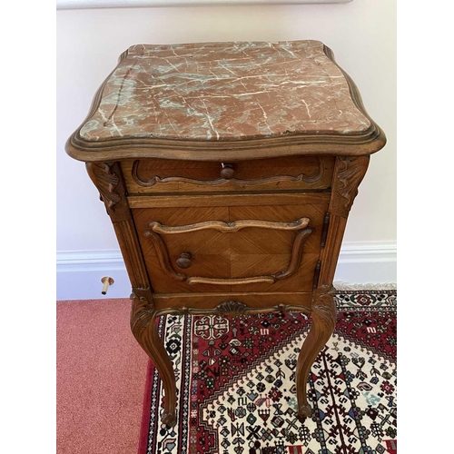 3146 - A French walnut bedside cupboard, late 19th century, with marble top above a door and a drawer on ca... 