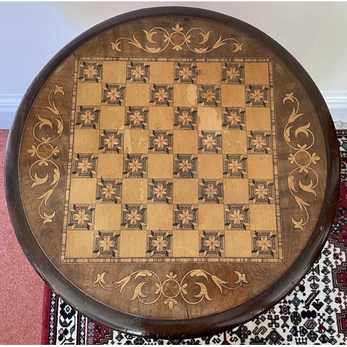 3147 - A Victorian walnut and inlaid sewing table, the circular top raised on a tapered and carved column a... 