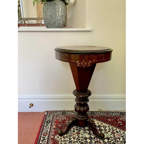 3147 - A Victorian walnut and inlaid sewing table, the circular top raised on a tapered and carved column a... 