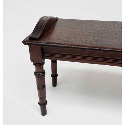 3150 - A Victorian mahogany hall bench, raised on turned legs. Height 47cm, width 91cm, depth 33cm.