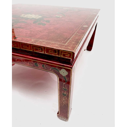 3151 - An oriental red lacquer low centre table, late 20th century, decorated in the Chinoiserie style. Hei... 