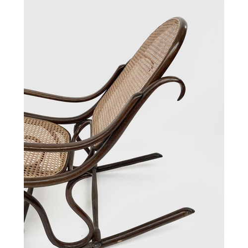 3155 - A mid 20th century bentwood rocking chair with caned back and seat. Height 83cm, total depth 104cm, ... 