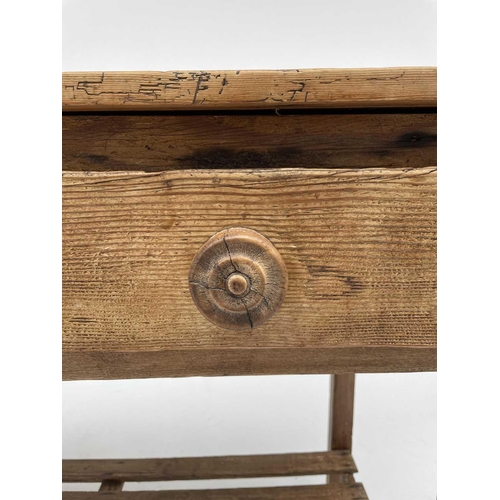 3162 - A Victorian pine kitchen side table, fitted with a long drawer, with lower rack. Height 80cm, width ... 