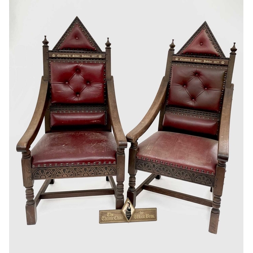 3163 - A pair of oak throne chairs, with leather upholstered backs and seats, produced to commemorate the 1... 