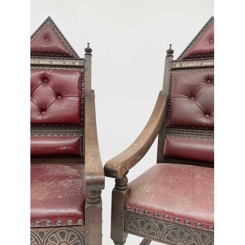 3163 - A pair of oak throne chairs, with leather upholstered backs and seats, produced to commemorate the 1... 