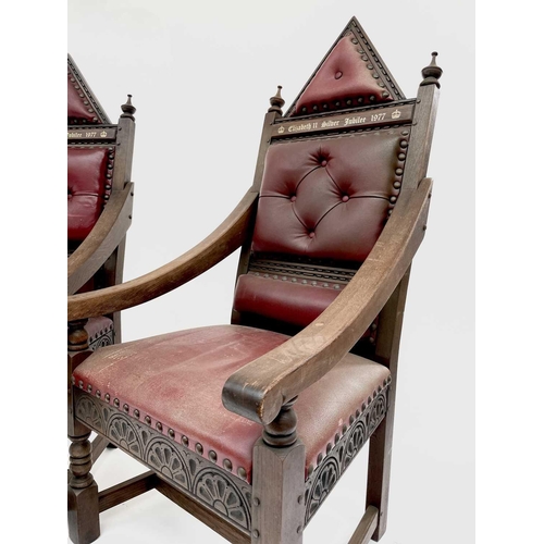 3163 - A pair of oak throne chairs, with leather upholstered backs and seats, produced to commemorate the 1... 