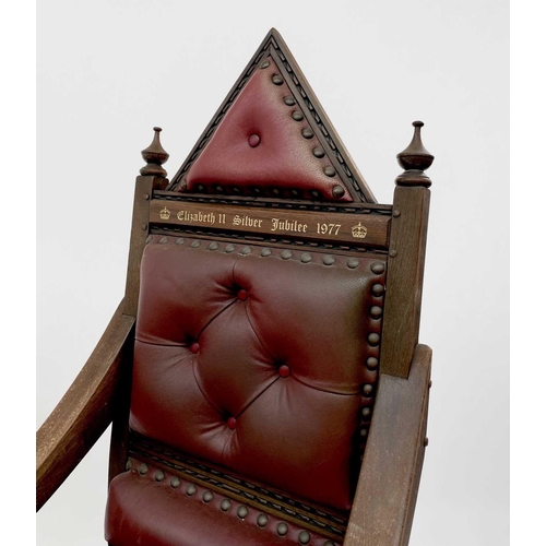 3163 - A pair of oak throne chairs, with leather upholstered backs and seats, produced to commemorate the 1... 