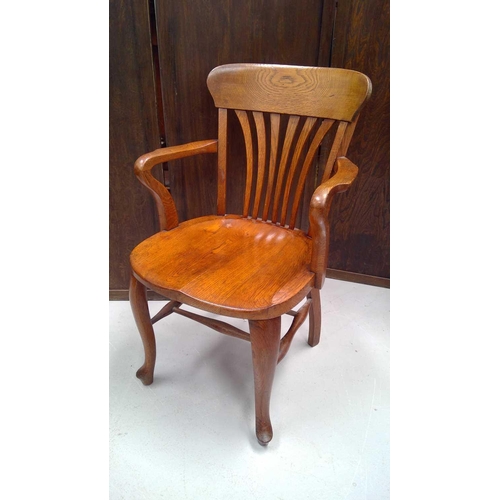 3166 - A late 19th/early 20th century elm office elbow chair.