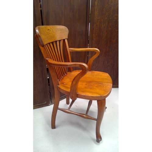 3166 - A late 19th/early 20th century elm office elbow chair.