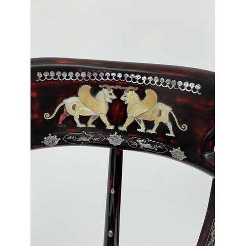 3177 - A pair of Chinese red lacquered corner armchairs, highly decorative with mother of pearl, the arms t... 