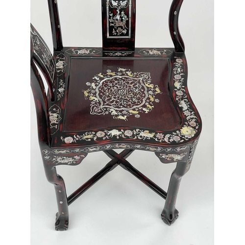 3177 - A pair of Chinese red lacquered corner armchairs, highly decorative with mother of pearl, the arms t... 