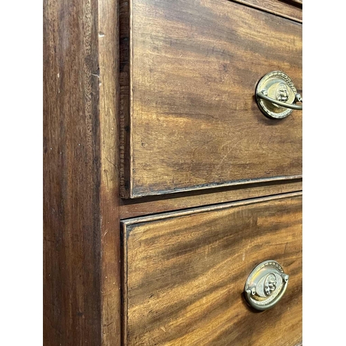 3180 - A mahogany chest of drawers, early 19th century, with two short and two long drawers, on splay feet,... 