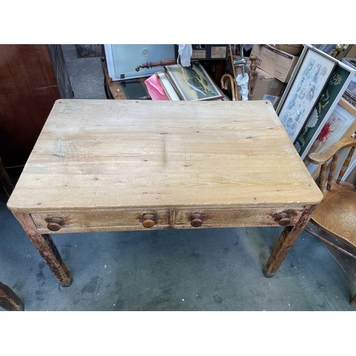 3182 - A Victorian pine kitchen table, the rectangular top with rounded corners, on partly turned square se... 