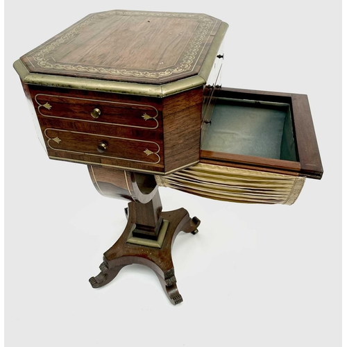 3184 - A Regency rosewood and brass inlaid work table, the octagonal top above two fitted drawers and dummy... 