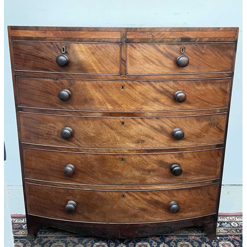 3190 - A Regency mahogany bow front chest of drawers, the satinwood crossbanded top above two short and fou... 