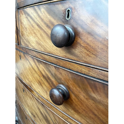 3190 - A Regency mahogany bow front chest of drawers, the satinwood crossbanded top above two short and fou... 