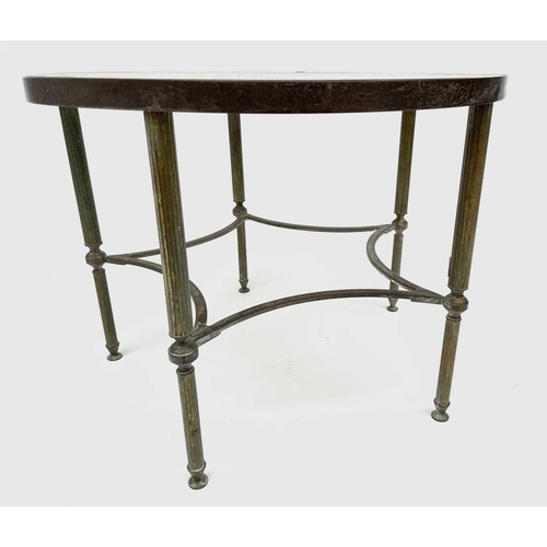 3193 - A glass topped gilt metal circular occasional table, raised on turned and fluted legs united by conc... 