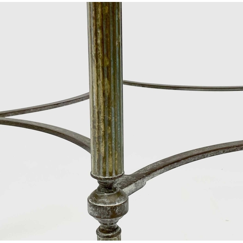 3193 - A glass topped gilt metal circular occasional table, raised on turned and fluted legs united by conc... 