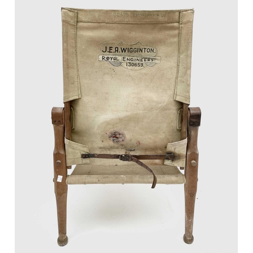 3194 - A WWI beech, leather and canvas campaign chair, the back inscribed J.E.A.Wigginton Royal Engineers, ... 