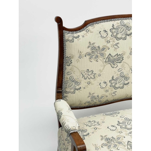 3196 - A late 19th early 20th-century French walnut upholstered settee, height 108cm width 144cm depth 62cm... 