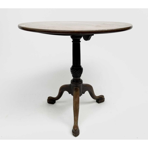 3198 - A George III mahogany tripod table, the circular top on a fluted baluster stem and cabriole legs, he... 