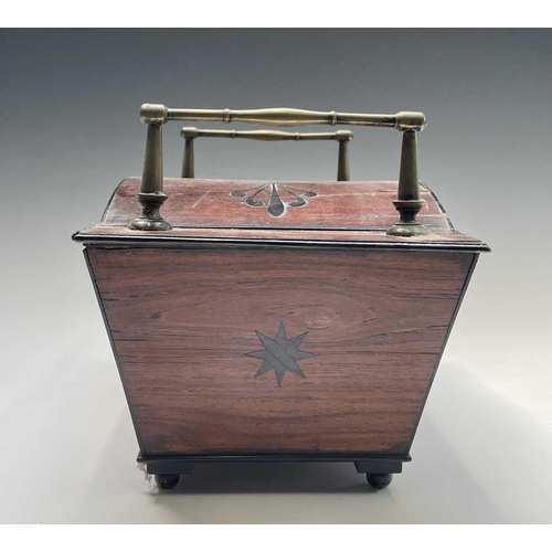 320 - A Regency mahogany and ebony inlaid box, of sarcophagus shape with slightly domed lid and raised bra... 