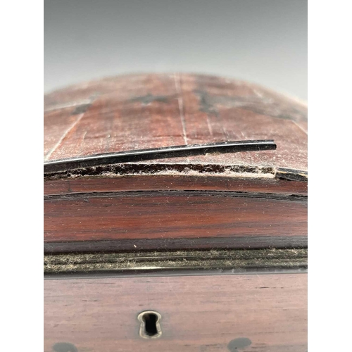 320 - A Regency mahogany and ebony inlaid box, of sarcophagus shape with slightly domed lid and raised bra... 