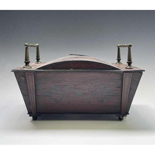 320 - A Regency mahogany and ebony inlaid box, of sarcophagus shape with slightly domed lid and raised bra... 