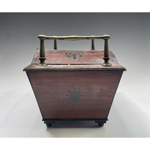 320 - A Regency mahogany and ebony inlaid box, of sarcophagus shape with slightly domed lid and raised bra... 