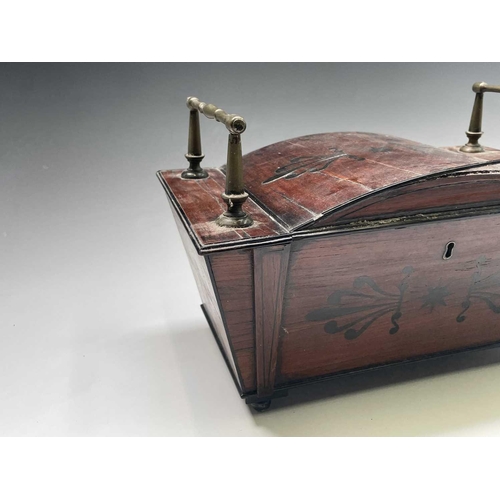 320 - A Regency mahogany and ebony inlaid box, of sarcophagus shape with slightly domed lid and raised bra... 