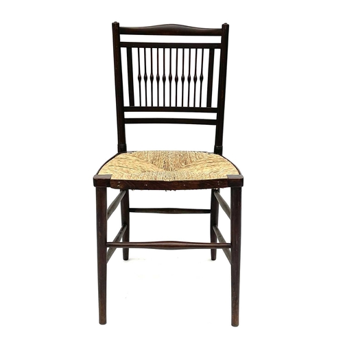 3201 - A walnut rush seated chair, early 20th century, in the Goodwin style, with spindle back.